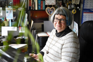Author Christine Pedley in her home office, said she wants to provide awareness and a resource for other parents.